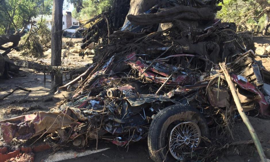 This crumbled car shows the force of the mudslide as debris roared through Montecito. Photo: James Cook via Twitter @BBCJAmesCool