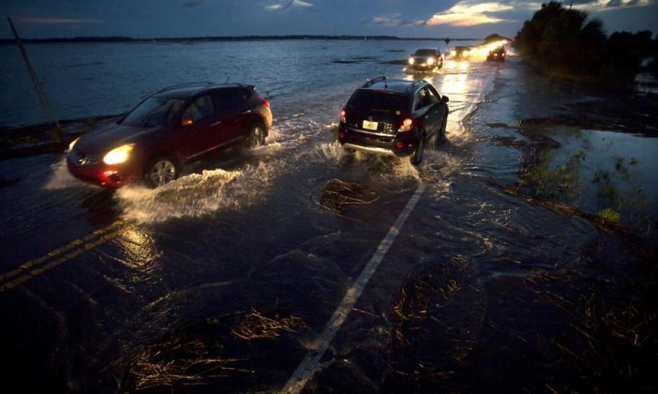 A perigean spring tide floods Highway 80, the only road to Tybee Island, Ga., June 4, 2016. Photo: Stephen B. Morton/The New York Times