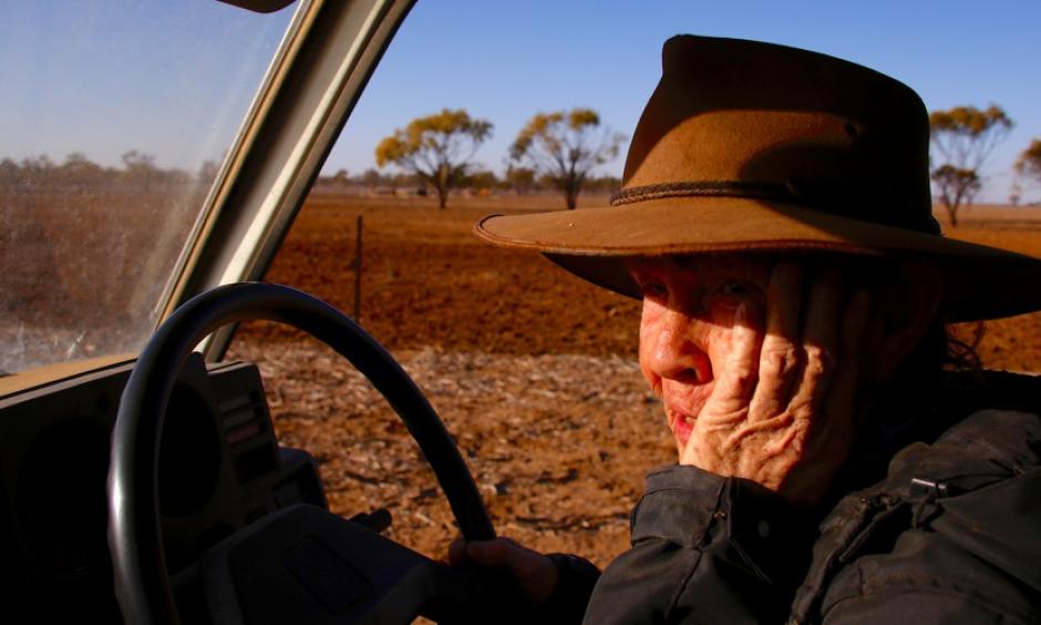 May McKeown, an Australian farmer, drives her truck to feed the remaining cattle on her drought-affected property in July. Photo: David Gray, Reuters