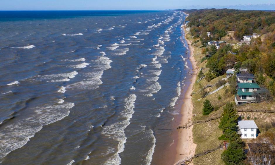 Lake Michigan waves batter the shoreline and cause erosion along North Shore Estates Road in Ferrysburg, Mich., on Oct. 23. Credit: Cory Morse, The Grand Rapids Press, AP