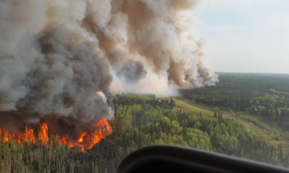 An aerial view of the flames roaring north of Fort McMurray on Tuesday afternoon. Photo: CBC News