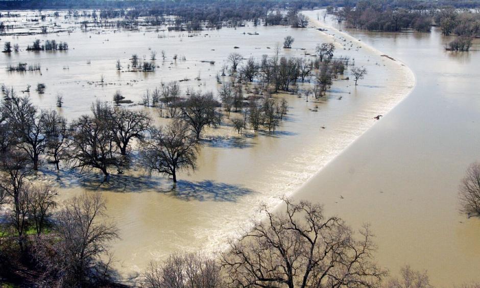 Water from the Sacramento River and Sutter Bypass travels over the Fremont Weir, the beginning of the Yolo Bypass, as it heads toward Sacramento. Photo: Randy Pench, The Sacrmaneto Bee