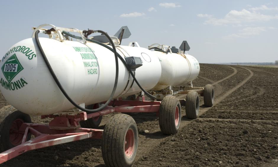 Anhydrous ammonia tanks in a newly planted wheat field. Walmart has promised big cuts in emissions of greenhouse gases. To meet that goal, though, the giant retailer may have to persuade farmers to use less fertilizer. It won't be easy. Photo: TheBusman / Getty Images