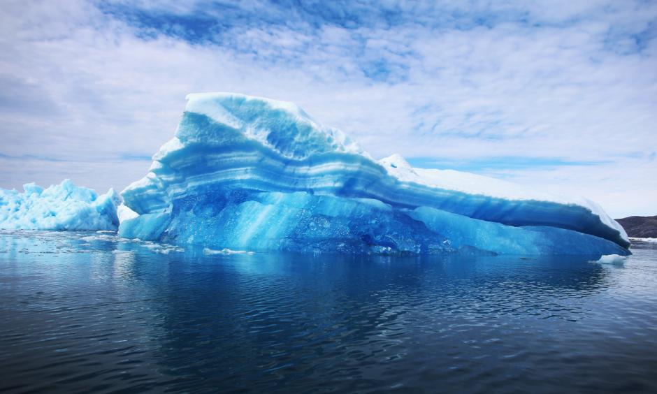 Calved icebergs from the nearby Twin Glaciers are seen floating on the water in Qaqortoq, Greenland. Photo: Joe Raedle, Getty Images