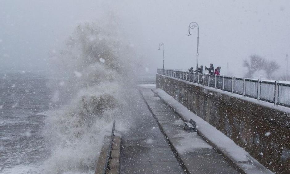 People watch as waves crash over the seawall along Lynn Shore Drive as Stella bears down on Lynn, MA, on Tuesday, March 14, 2017. Photo: Scott Eisen, Getty Images