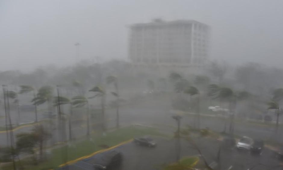 Rain and wind hit a parking lot at Roberto Clemente Coliseum in San Juan, Puerto Rico, on September 20, 2017, during the passage of Hurricane Maria. Photo: Hector Retamal, AFP/Getty Images