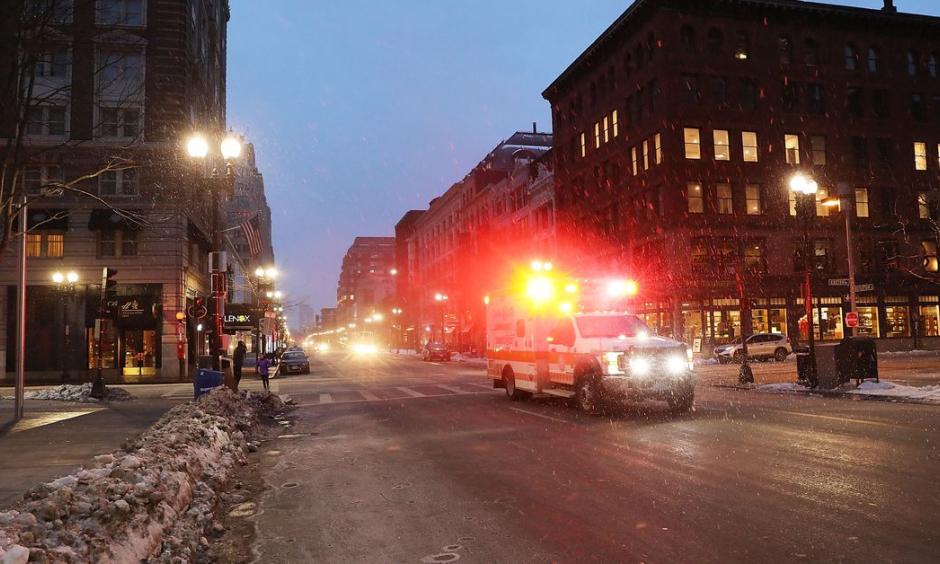 An ambulance drives through Boston as the snow begins to fall during a massive winter storm on January 4, 2018. Photo: Spencer Platt, Getty Images