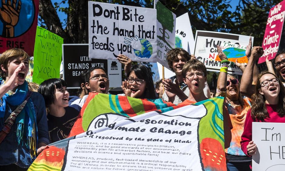 The Salt Lake Tribune Participants rally while holding their 'Student Resolution on Climate Change the Governor's Mansion during the Utah People's Climate March Saturday, April 29, 2017. Photo: Chris Detrick