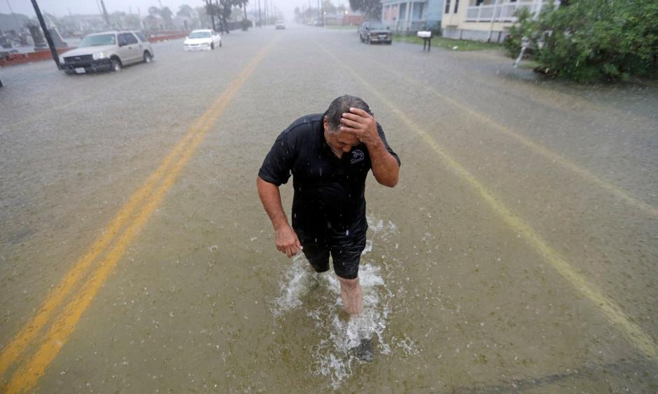 Angel Marshman wades through floodwaters from Tropical Depression Imelda after trying to start his flooded car on Sept. 18 in Galveston, Tex. Credit: David J. Phillip, AP