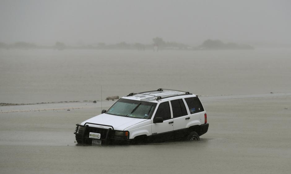 A car is partially submerged after Harvey hit Corpus Christi. Photo: Mark Ralston, AFP/Getty Images