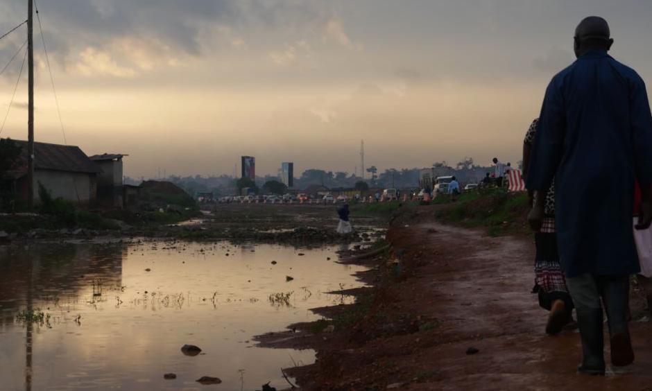 Settlements along drainage pathways often causes flooding and stagnant water along walkways. These large pools of water increase the risk of diseases such as malaria and cholera. Photo: E. Paulat, VOA