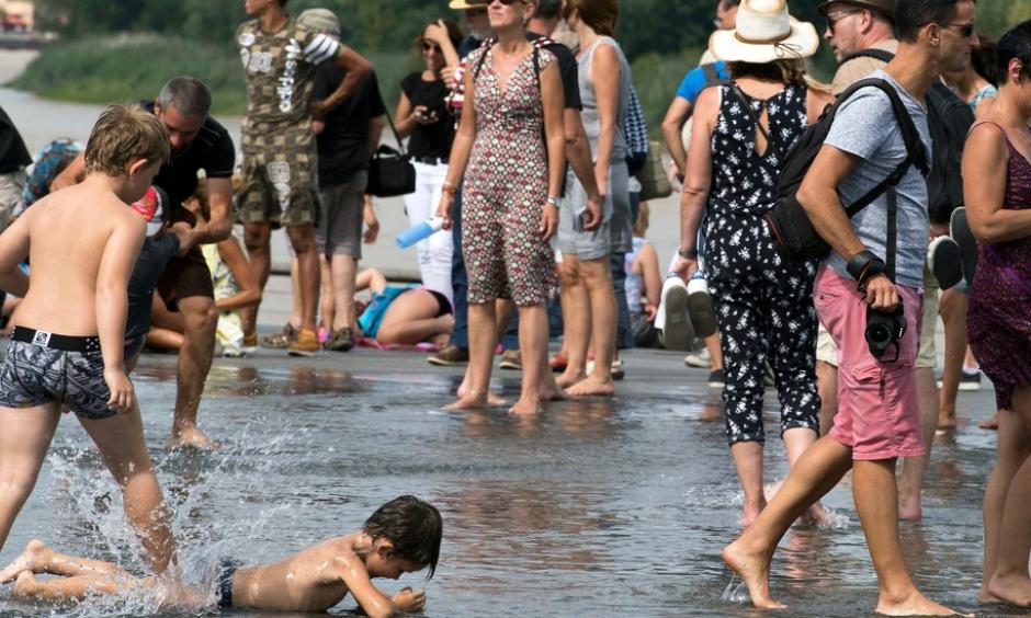 Locals and tourists refreshed themselves in the Water Mirror fountain in the center of Bordeaux, France, on Friday. Photo: Caroline Blumberg/European Pressphoto Agency