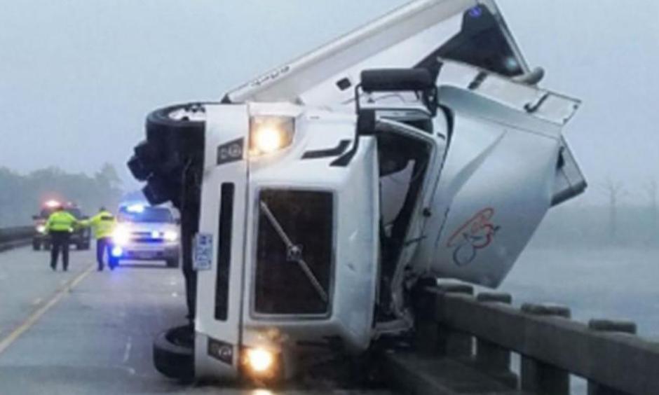 A man was killed Saturday after his tractor-trailer overturned because of high winds on the Lindsay C. Warren Bridge east of Columbia, North Carolina. Photo: Tyrrell County Sheriff's Office