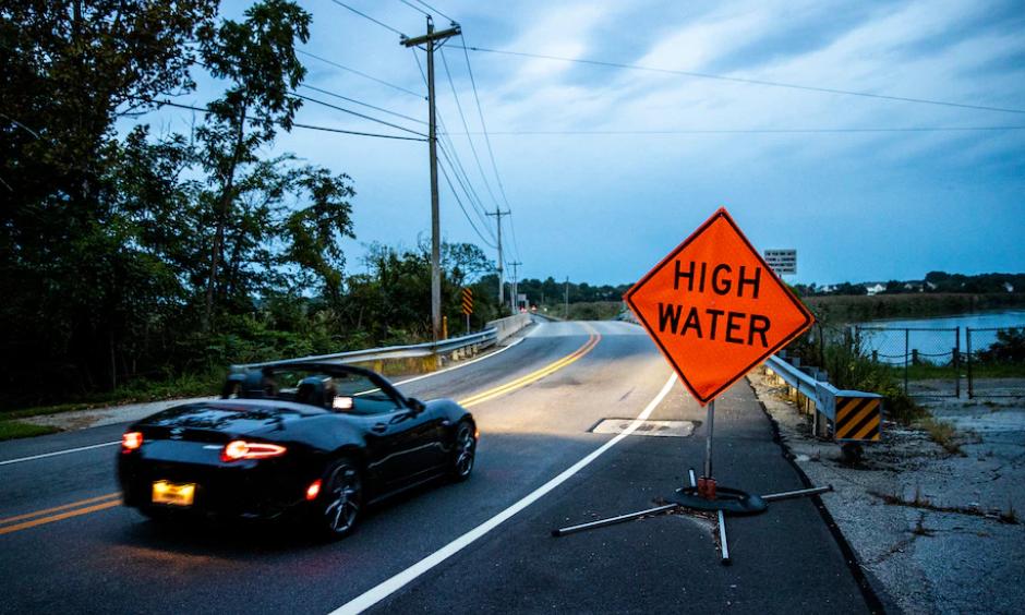 A vehicle crosses the Appoquinimink River along Old State Road in Odessa, Del. (Kyle Grantham for The Washington Post)