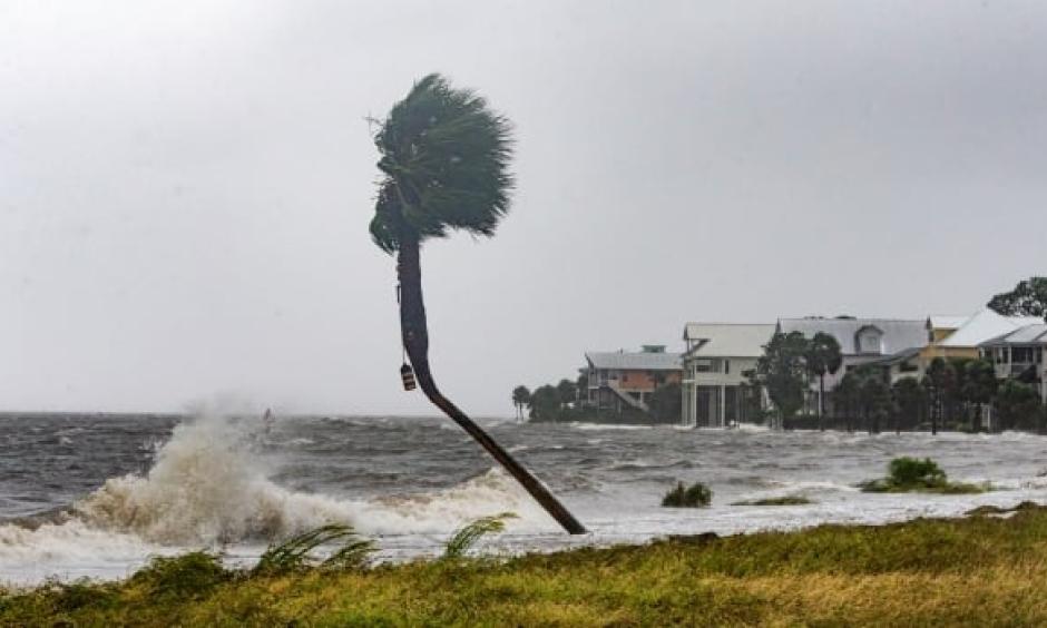 The storm surge and waves from Hurricane Michael are shown near beachfront homes on Wednesday in the Florida Panhandle community of Shell Point Beach. Photo: Mark Wallheiser, Getty Images