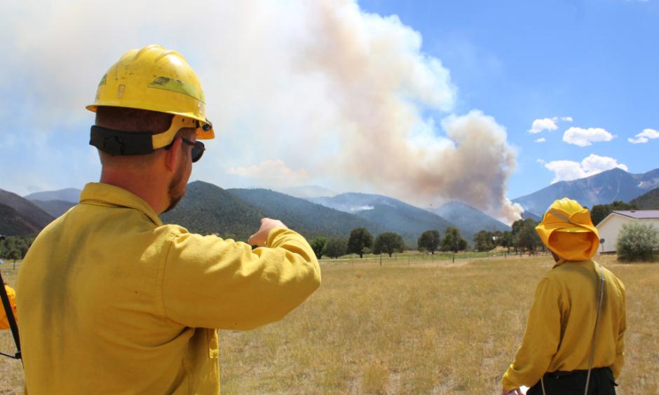Public Information Officer Evan Burks watches how the Hayden Pass fire is moving on Thursday afternoon, July 14, 2016. Photo: Sarah Matott, Daily Record