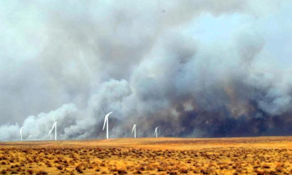 Smoke billows behind wind turbines north of Fleming Monday afternoon. A wildfire burned out of control from the Crook and Proctor area south and east into Phillips County, fueled by dry conditions and strong winds. Photo: Jeff Rice, Sterling Journal-Advocate