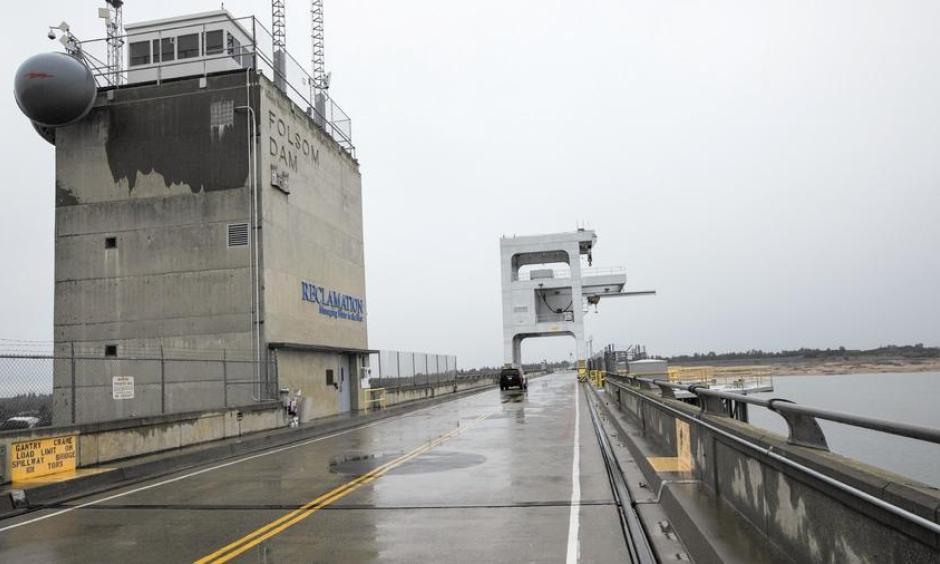 After months of El Niño rainfall, Folsom Lake became so full that excess water was being released over Folsom Dam, above. But reservoirs in Central and Southern California remain well below their averages. Photo: Brian van der Brug, Los Angeles Times