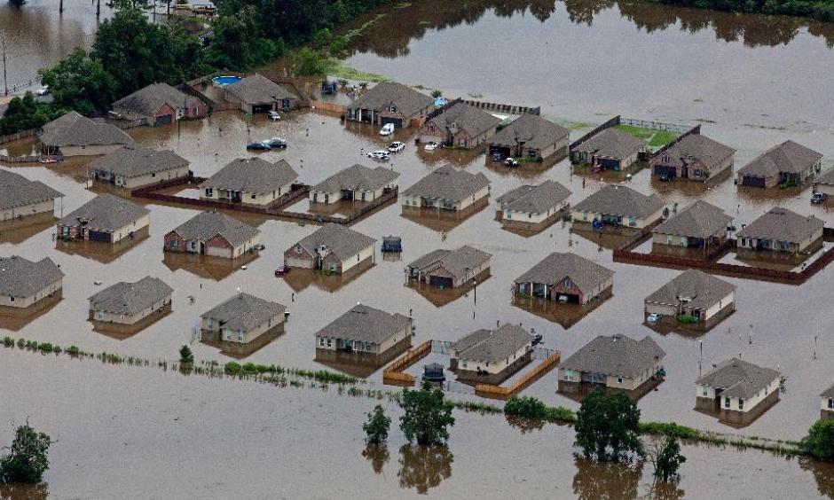 In this aerial photo over Hammond, La., flooded homes are seen off of LA-1064 after heavy rains inundated the region, Saturday, Aug. 13, 2016. Photo: Max Becherer, AP