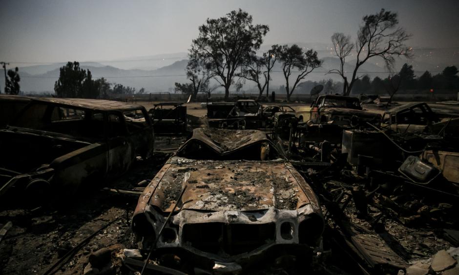 Burned vehicles glow in the light of the full moon on Highway 138 in Phelan as the Blue Cut fire burned in San Bernardino County. Photo: Marcus Yam / Los Angeles Times