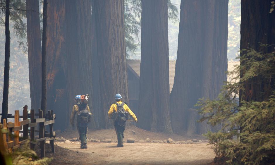 Members of the Sierra Hot Shots walk through Camp Pico Blanco on Aug. 6. The Boy Scout camp went undamaged from the Soberanes Fire. Photo: Vern Fisher / Associated Press