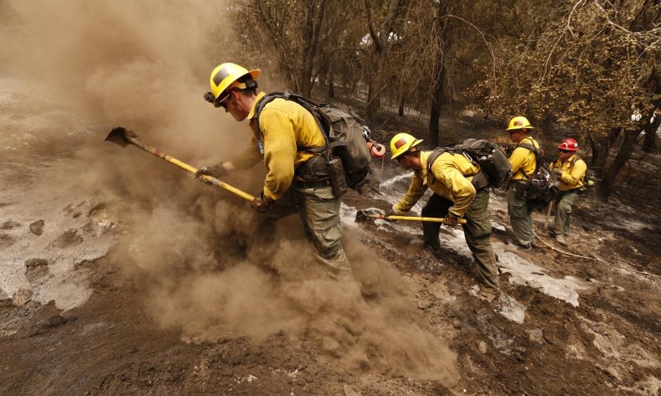 Whittier Fire. From left, firefighters Aaron Williams, Lyle Bennett Robert Larios and Captain Crawford Gunn, with San Bernardino National Forest put out hot spots Monday morning along State Highway 154 in the Santa Ynez Valley of Santa Barbara County. Photo: Al Seib, Los Angeles Times