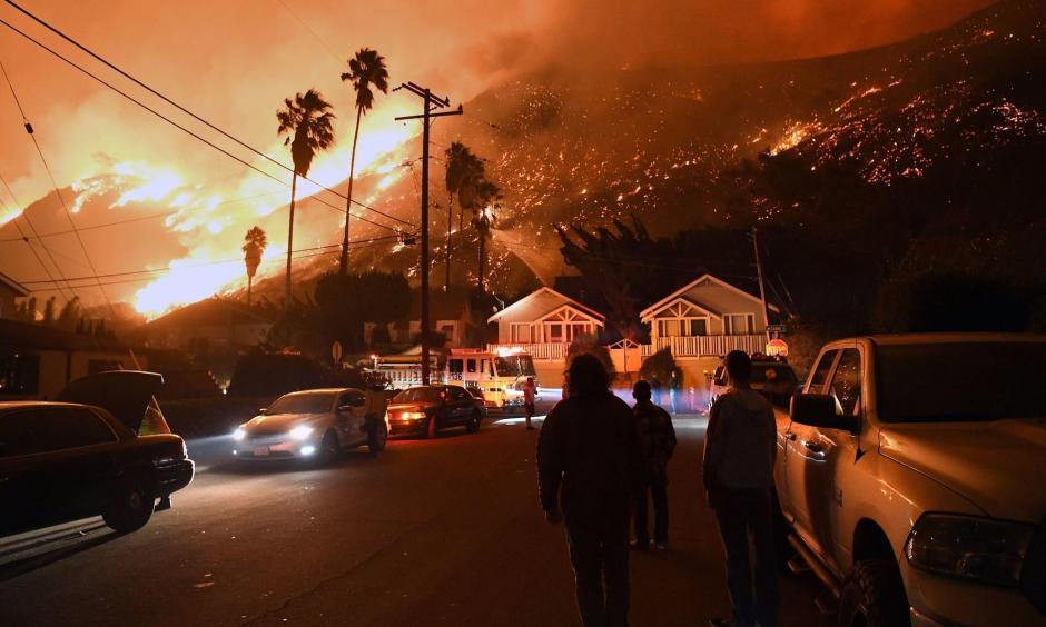 Residents watch the Thomas fire burn from Prospect Street in Ventura. Climate change makes fires more likely, for a variety of reasons. Photo: Michael Owen Baker, LA Times