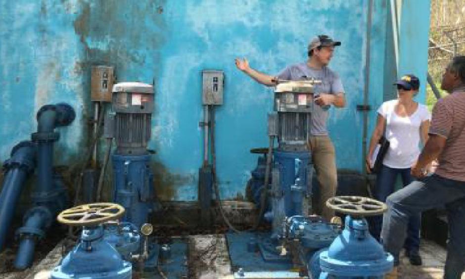 The Environmental Protection Agency and partners examine the drinking water system that isn't run by the government's water and sewer services in Cañabón, Puerto Rico, following the storm. Photo: EPA