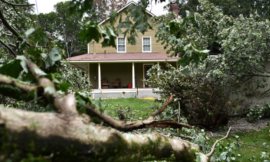 Debris cluttered Betty and Tom Therrien’s yard after a tornado swept through the area near Douglas, Mass., last month. Photo: Christine Peterson, Worcester Telegram & Gazette via Associated Press