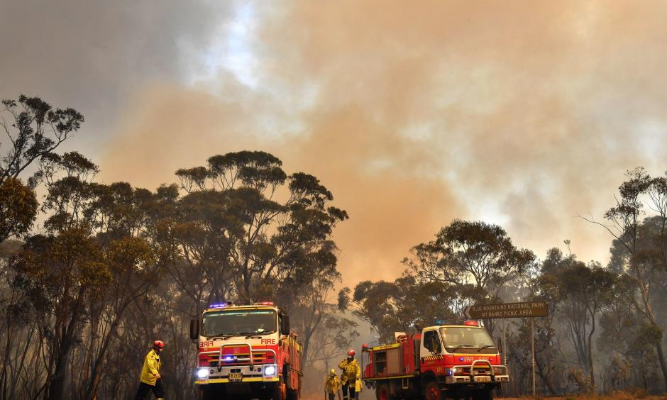 Fighting fires northwest of Sydney. Credit: Dean Lewins/EPA