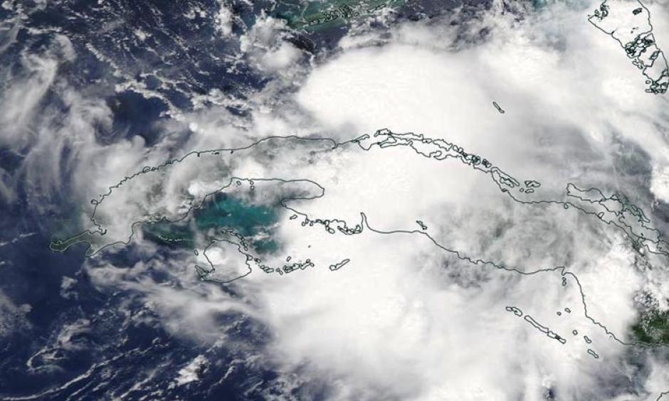 MODIS visible satellite image of Tropical Depression Nine (formerly 99L) forming in the Florida Straits on Sunday afternoon, August 28, 2016. Image: NASA