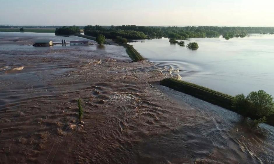 A breached levee on the Arkansas River, a common sight this spring. Photo: AP