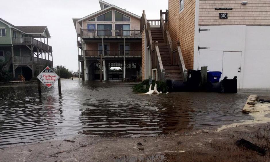 Floodwaters surround homes as Hurricane Maria moves closer to North Carolina's Outer Banks on Tuesday, Sept. 26, 2017. Thousands of visitors abandoned their vacation plans and left the area as the hurricane moved northward in the Atlantic, churning up surf and possible flooding. Photo: Ben Finley, AP