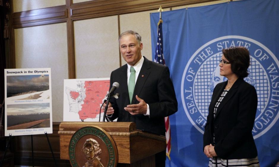 Washington Gov. Jay Inslee talks to the media about his statewide drought emergency as state ecology director Maia Bellon looks on, Friday, May 15, 2015, in Olympia, Wash. Credit: AP
