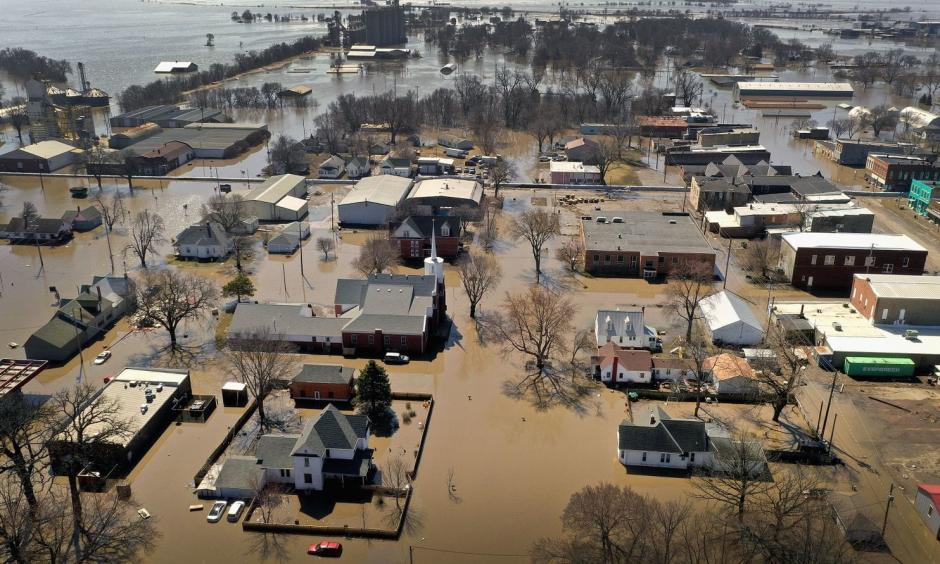 Homes and businesses are surrounded by floodwater in Hamburg, Iowa. Several Midwest states are battling some of the worst flooding they have experienced in decades as rain and snow melt from the recent “bomb cyclone” has inundated rivers and streams. Photo: Scott Olson, Getty Images