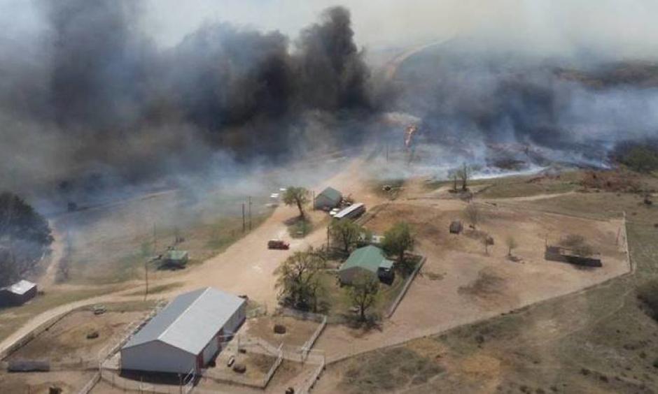The Anderson Creek Fire threatening ranch buildings in Woods County, Okla., on Thursday. The fire has burned nearly 400,000 acres in two states. Photo: Oklahoma Forestry Services