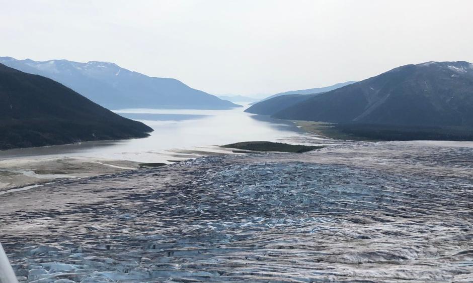 The terminus of Taku Glacier and the Taku River are seen from an aircraft, looking southwest, on Aug. 2. Credit: James Brooks/ADN