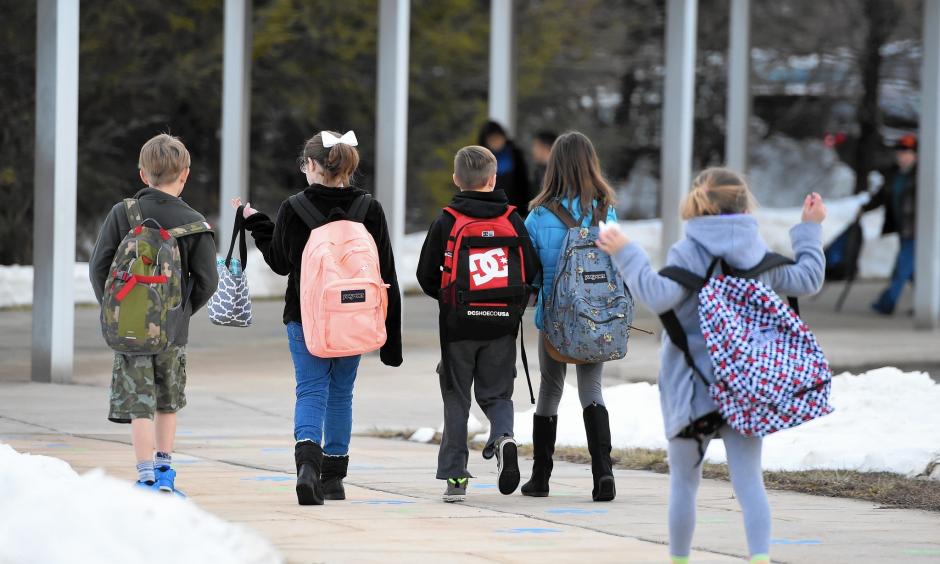 Students made their way into Forest Lakes Elementary School Monday morning to begin their day after a week long break because of last week's blizzard. Photo: Matt Button, Aegis Staff, Baltimore Sun