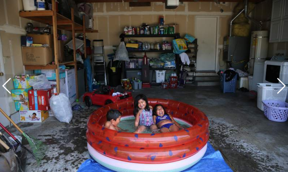 Sisters Nyla Herrera, 9, right, and Jaylah, 5, and their cousin Damon Knight, 6, swim in a kiddie pool in the girl's family garage to stay out of the heat of the direct sunlight in Santa Rosa on Monday, June 10, 2019. Photo: Beth Schlanker, The Press Democrat