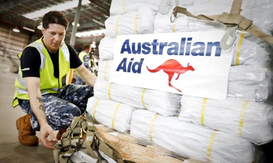 Officer in Charge of Air Movements at RAAF Amberley, Flying Officer Don Ninness, prepares Australian Aid before it is loaded onto a No. 36 Squadron C-17A aircraft destined for Cyclone Winston-affected Fiji at RAAF Base Amberley near Brisbane, February 23, 2016. Photo: Australian Defence Force, Reuters