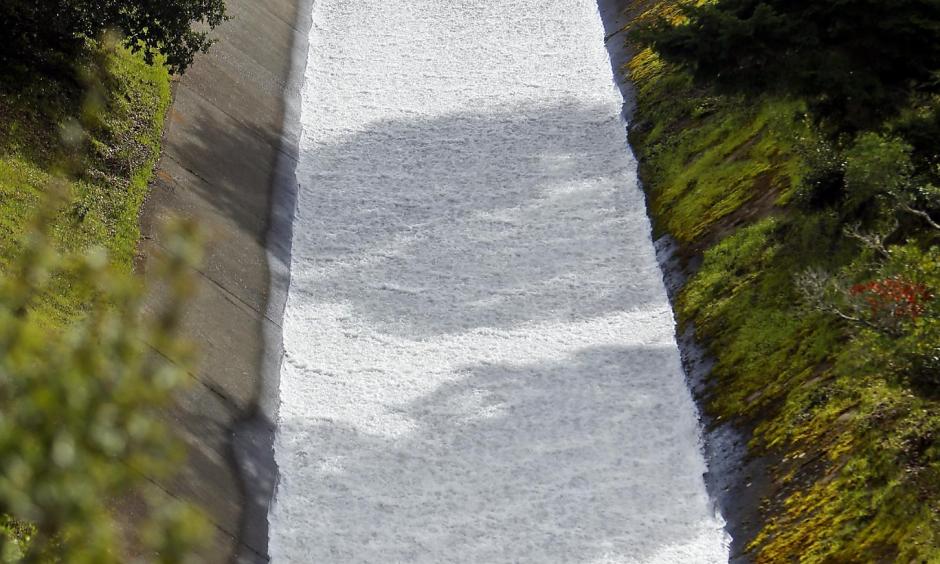 Water pours through the Bon Tempe Dam in Fairfax as rainfall totals surpass average. Photo: Scott Strazzante, The Chronicle