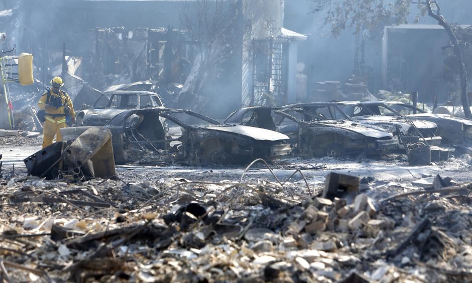 Burned out vehicles at an auto repair shop on Main Street during Clayton Fire in Lower Lake, Calif., on Monday, August 15, 2016. Photo: Scott Strazzante, The Chronicle