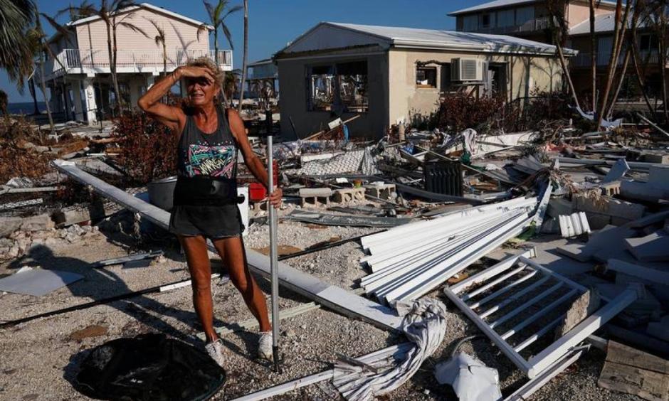 A woman surveys the damage to her mother's house following Hurricane Irma in Big Pine Key, Florida, U.S., September 18, 2017. Photo: Carlo Allegri, Reuters