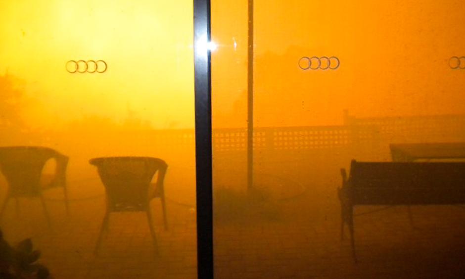 An orange smoke cloud fills Paula Tose's loungeroom window as the Sampson Flat bushfire roars up the valley and towards her home. Photo: Paula Tose