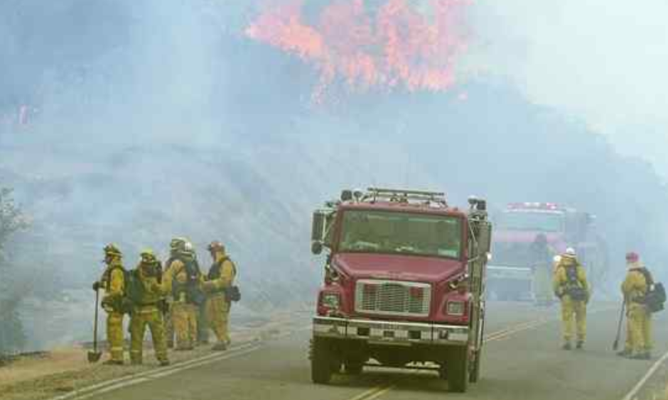 Firefighters perform a firing operation along Interlake Road while battling the Chimney Fire in southern Monterey County on Tuesday. The fire started south of Nacimiento Reservoir in San Luis Obispo County. Photo: David Royal, Monterey Herald