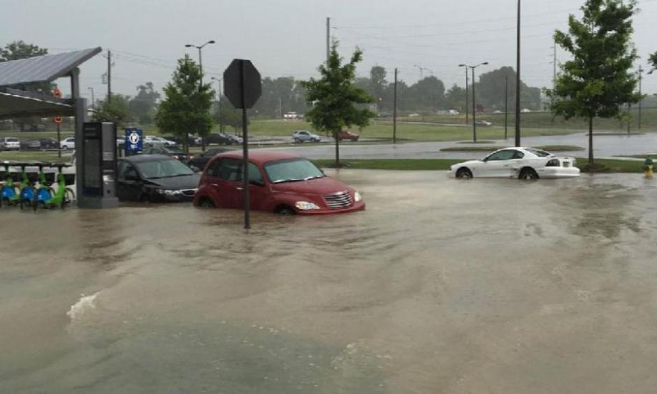 Floodwaters rise up around cars in Birmingham, Alabama, on Monday, June 27, 2016. Photo: Instagram/b.nektarmark
