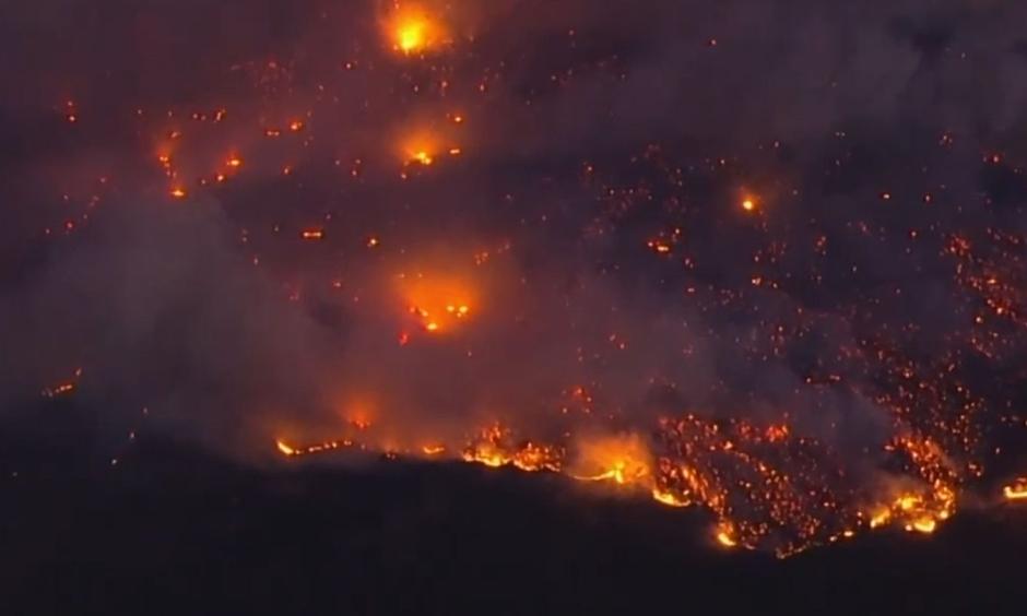 A fast-moving Northern California wildfire driven by fierce winds threatened the Sonoma County town of Geyserville on Oct. 24, prompting mandatory evacuations. Credit: Reuters