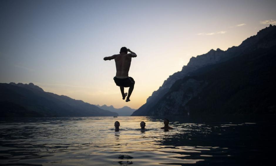 French emergency services are urging bathers to enter water gradually to avoid potential deadly 'thermic shock' to the body, which can shut down due to rapid temperature changes. Credit: Rex, Gian Ehrenzeller, EPA
