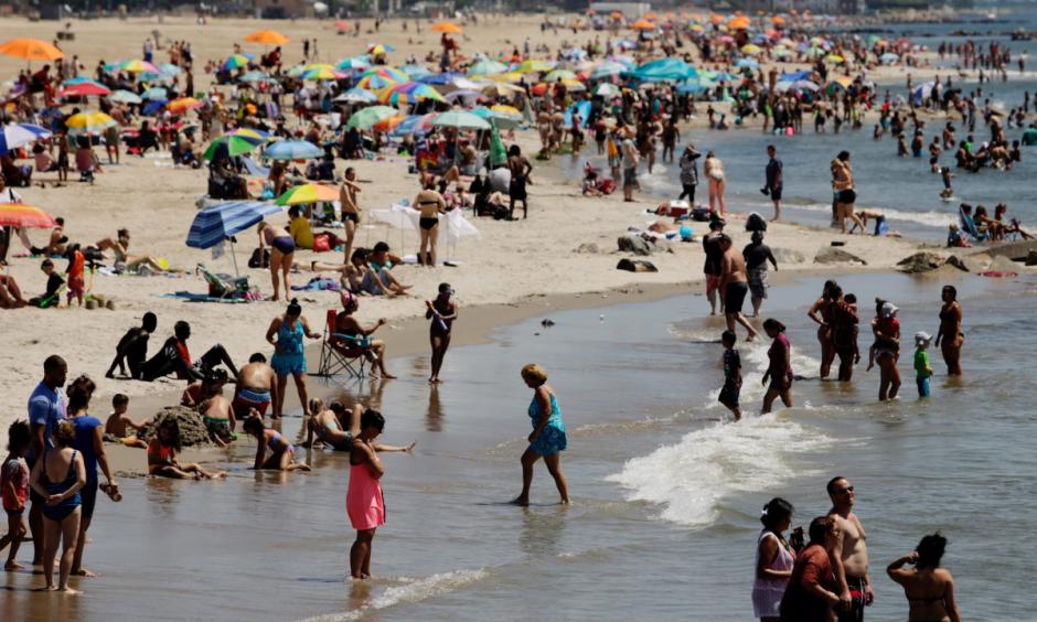 New Yorkers enjoy the beach in Coney Island. Photo: EPA
