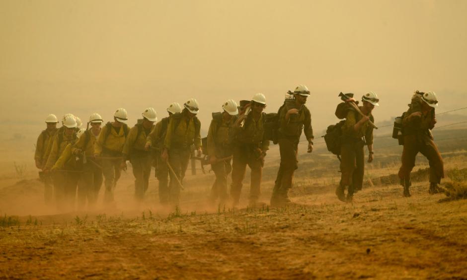 Members of the Craig Hotshots return to their crew cabs after a long day of fighting the Weston Pass Fire on July 2, 2018 near FairPlay. Credit: Helen H. Richardson, The Denver Post